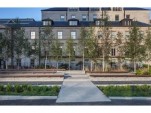 Concrete ‘bridge’ crossing the planting bed that aligns with the reflecting pool