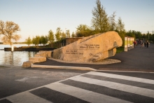 The north park entrance is signified with a 52 tonne natural boulder, information signage and washroom building behind.