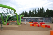 Children’s Play – climbing structure and chalk wall enclosure of park mechanical